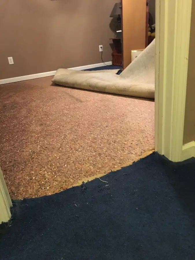 Carpet pad removal revealing water damage during Drying & Dehumidification in Yuba City